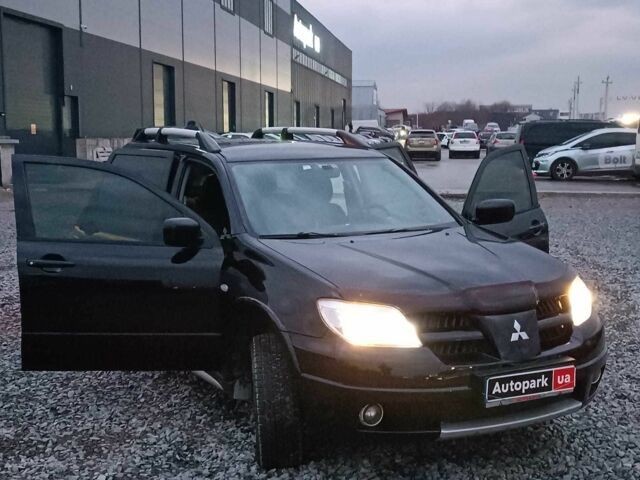 Черный Мицубиси Аутлендер, объемом двигателя 2 л и пробегом 271 тыс. км за 6940 $, фото 22 на Automoto.ua