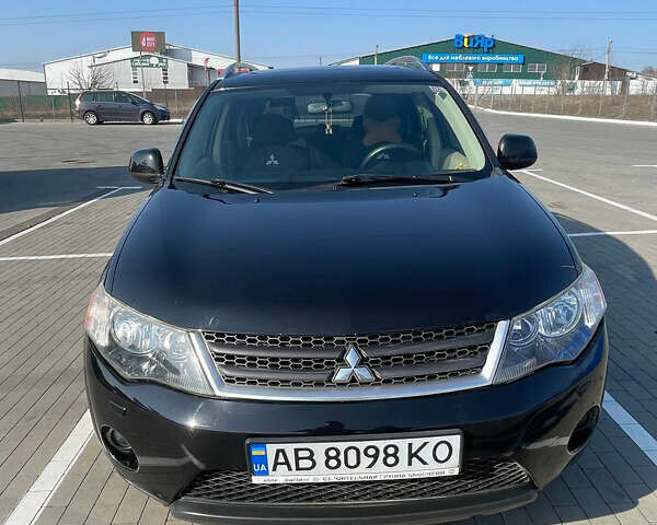 Чорний Міцубісі Аутлендер, об'ємом двигуна 2.4 л та пробігом 195 тис. км за 8600 $, фото 1 на Automoto.ua
