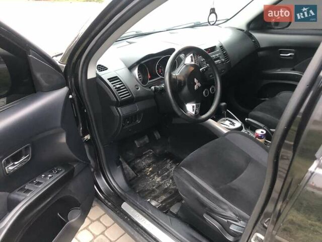 Чорний Міцубісі Аутлендер, об'ємом двигуна 2.4 л та пробігом 199 тис. км за 8999 $, фото 1 на Automoto.ua