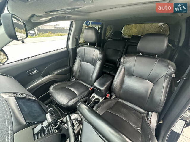 Чорний Міцубісі Аутлендер, об'ємом двигуна 2.4 л та пробігом 218 тис. км за 10000 $, фото 3 на Automoto.ua