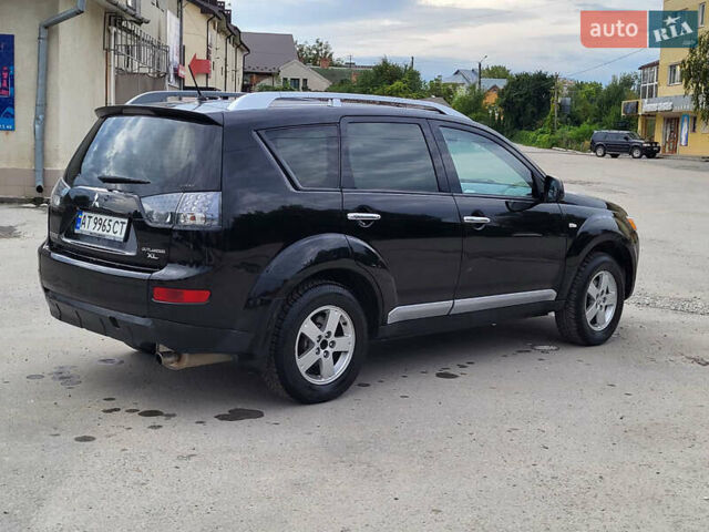 Чорний Міцубісі Аутлендер, об'ємом двигуна 2.4 л та пробігом 205 тис. км за 8400 $, фото 4 на Automoto.ua