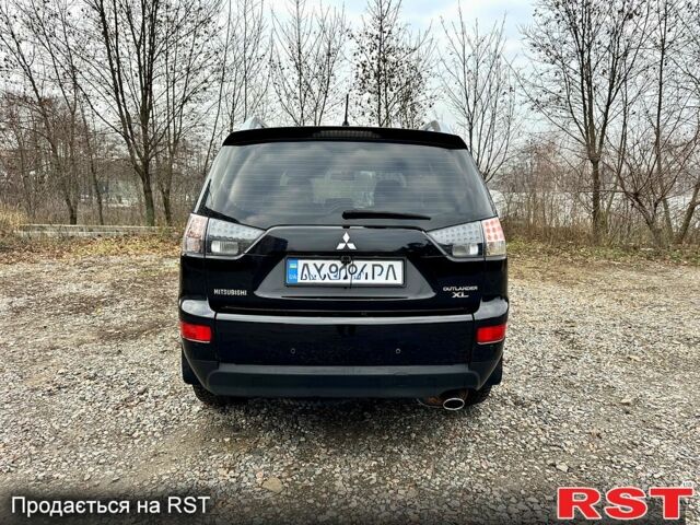 Черный Мицубиси Аутлендер, объемом двигателя 2.4 л и пробегом 229 тыс. км за 9790 $, фото 5 на Automoto.ua