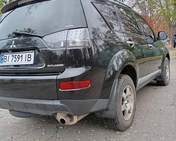 Чорний Міцубісі Аутлендер, об'ємом двигуна 2.36 л та пробігом 265 тис. км за 8800 $, фото 18 на Automoto.ua