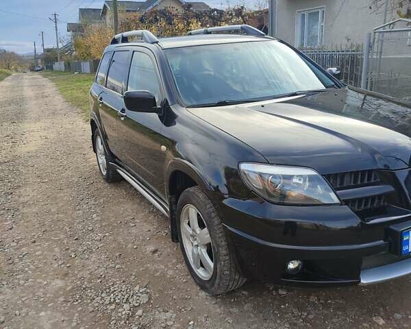 Міцубісі Аутлендер 2008 у Івано-Франківську на Automoto.ua Чорний Міцубісі Аутлендер, об'ємом двигуна 2 л та пробігом 128 тис. км за 7000 $, фото 16 на Automoto.ua