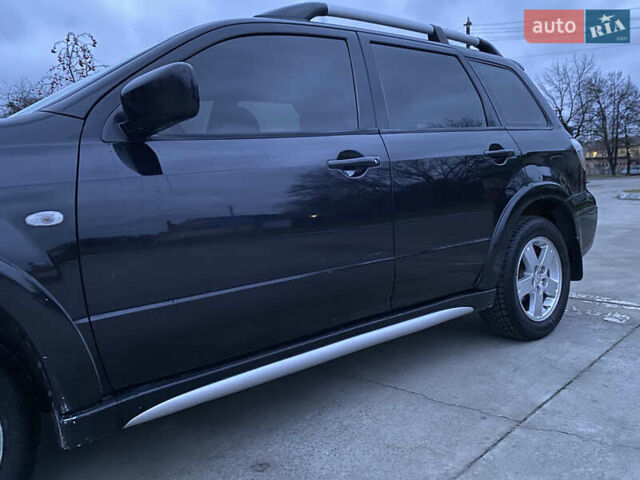 Чорний Міцубісі Аутлендер, об'ємом двигуна 2 л та пробігом 271 тис. км за 6799 $, фото 2 на Automoto.ua