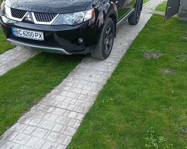 Черный Мицубиси Аутлендер, объемом двигателя 2.35 л и пробегом 245 тыс. км за 8000 $, фото 26 на Automoto.ua