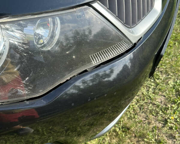 Черный Мицубиси Аутлендер, объемом двигателя 2.36 л и пробегом 240 тыс. км за 9599 $, фото 9 на Automoto.ua