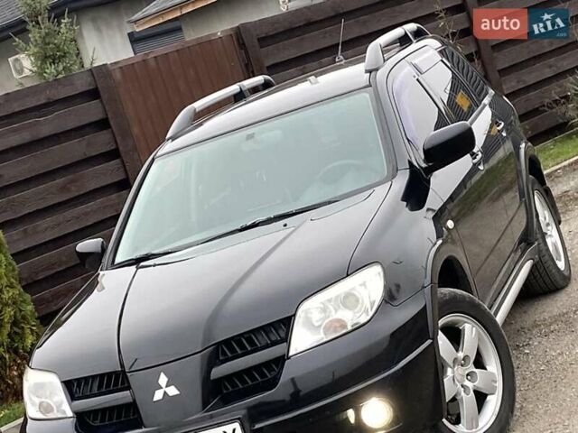 Черный Мицубиси Аутлендер, объемом двигателя 2.4 л и пробегом 178 тыс. км за 6900 $, фото 6 на Automoto.ua