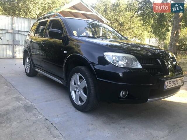 Чорний Міцубісі Аутлендер, об'ємом двигуна 2.38 л та пробігом 207 тис. км за 7000 $, фото 84 на Automoto.ua