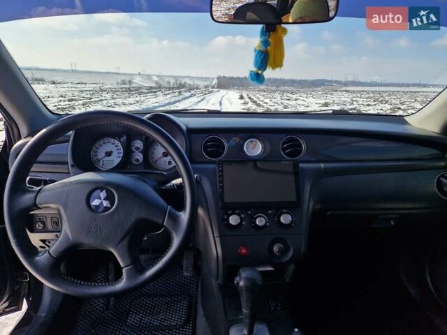 Чорний Міцубісі Аутлендер, об'ємом двигуна 2.4 л та пробігом 245 тис. км за 7100 $, фото 14 на Automoto.ua