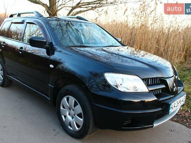 Черный Мицубиси Аутлендер, объемом двигателя 2 л и пробегом 190 тыс. км за 6900 $, фото 23 на Automoto.ua