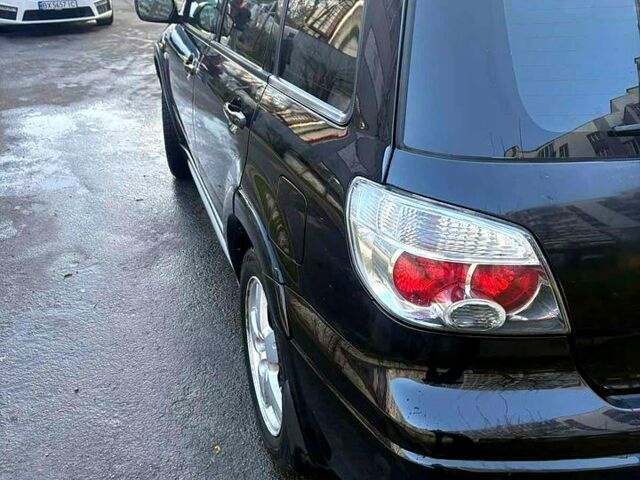 Черный Мицубиси Аутлендер, объемом двигателя 2.4 л и пробегом 231 тыс. км за 8500 $, фото 2 на Automoto.ua