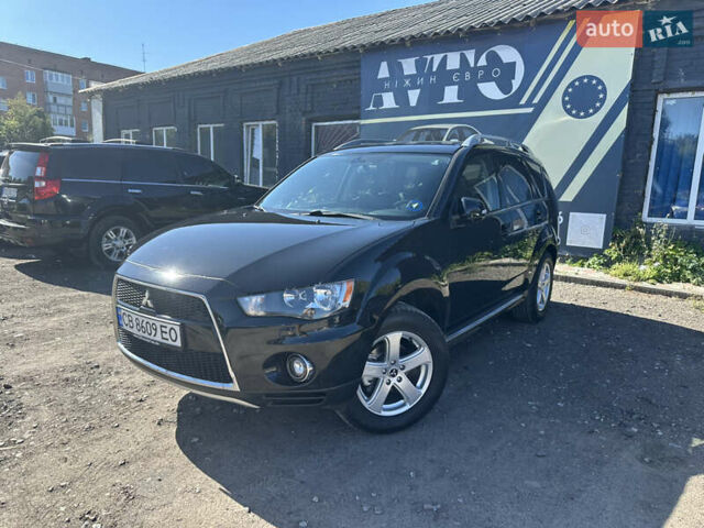 Черный Мицубиси Аутлендер, объемом двигателя 2 л и пробегом 240 тыс. км за 10999 $, фото 1 на Automoto.ua