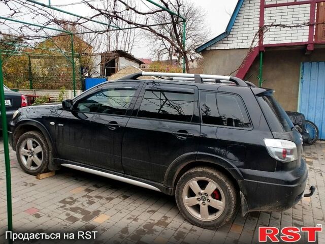 Черный Мицубиси Аутлендер, объемом двигателя 2 л и пробегом 280 тыс. км за 5800 $, фото 2 на Automoto.ua