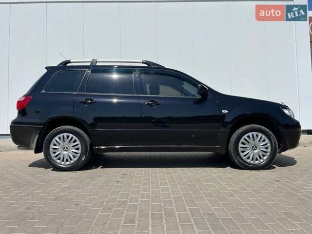 Черный Мицубиси Аутлендер, объемом двигателя 2 л и пробегом 236 тыс. км за 6699 $, фото 3 на Automoto.ua