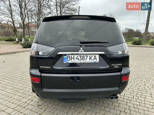 Черный Мицубиси Аутлендер, объемом двигателя 3 л и пробегом 77 тыс. км за 11800 $, фото 3 на Automoto.ua