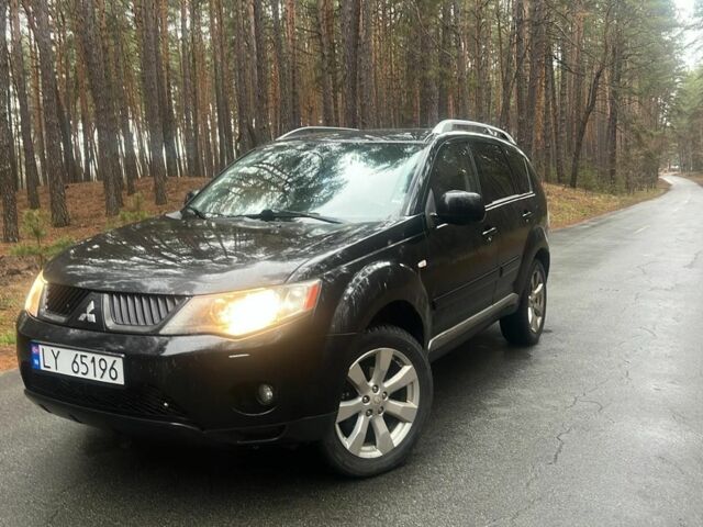 Черный Мицубиси Аутлендер, объемом двигателя 2 л и пробегом 280 тыс. км за 4500 $, фото 1 на Automoto.ua