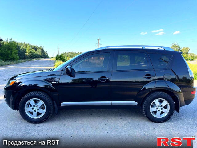 Чорний Міцубісі Аутлендер, об'ємом двигуна 2.4 л та пробігом 171 тис. км за 8999 $, фото 4 на Automoto.ua