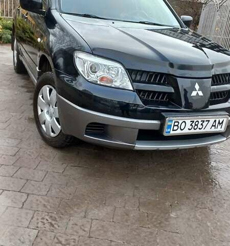 Черный Мицубиси Аутлендер, объемом двигателя 2 л и пробегом 73 тыс. км за 9500 $, фото 14 на Automoto.ua