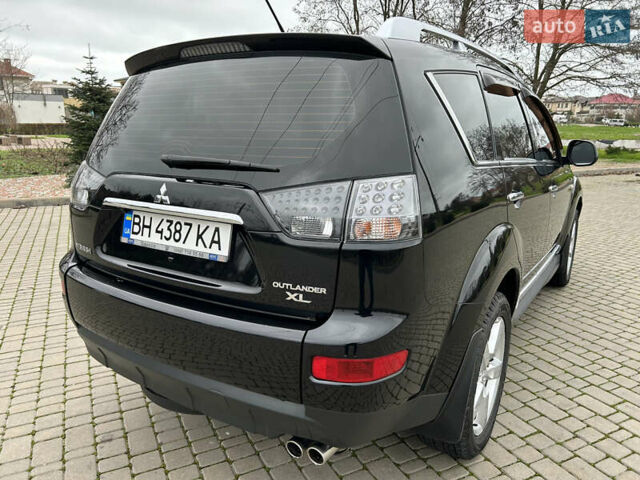 Черный Мицубиси Аутлендер, объемом двигателя 3 л и пробегом 77 тыс. км за 11800 $, фото 2 на Automoto.ua