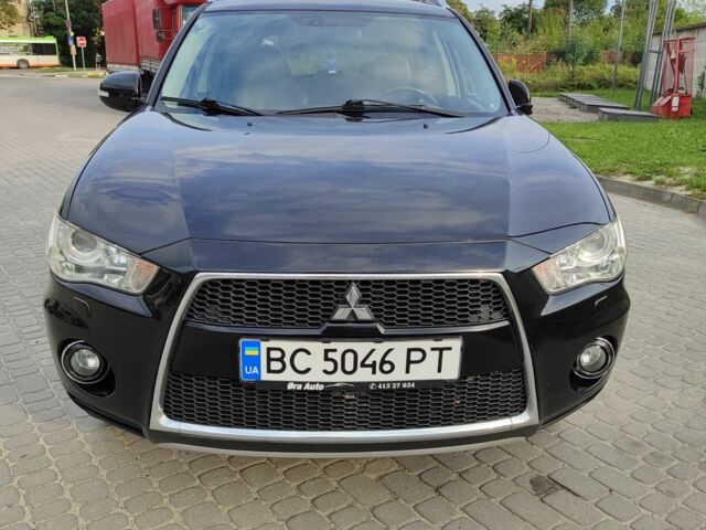 Черный Мицубиси Аутлендер, объемом двигателя 2 л и пробегом 104 тыс. км за 9900 $, фото 1 на Automoto.ua