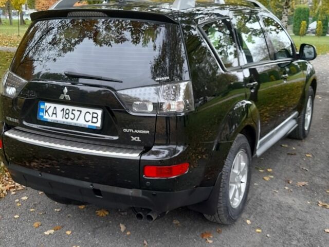 Міцубісі Аутлендер 2009 у Хмельницькому на Automoto.ua Чорний Міцубісі Аутлендер, об'ємом двигуна 2.4 л та пробігом 157 тис. км за 8500 $, фото 7 на Automoto.ua