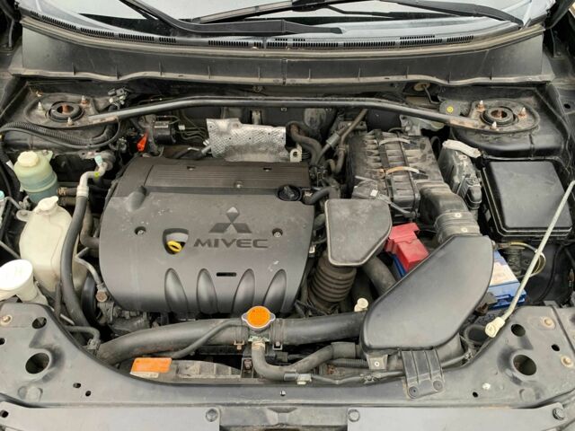 Черный Мицубиси Аутлендер, объемом двигателя 2.4 л и пробегом 175 тыс. км за 10499 $, фото 20 на Automoto.ua