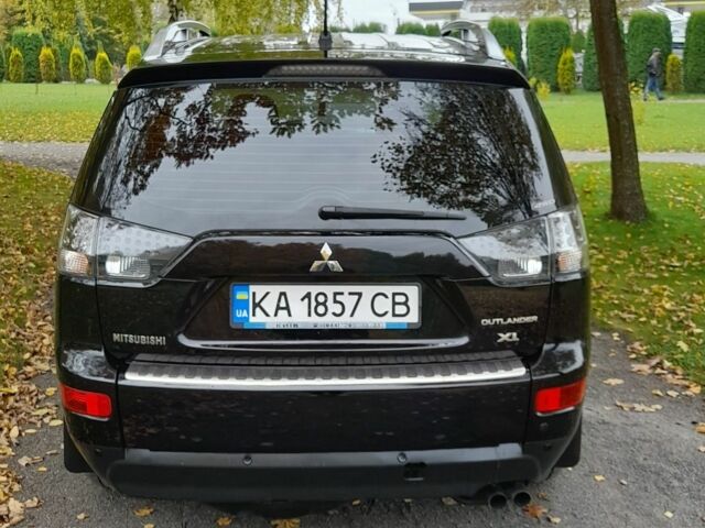 Міцубісі Аутлендер 2009 у Хмельницькому на Automoto.ua Чорний Міцубісі Аутлендер, об'ємом двигуна 2.4 л та пробігом 157 тис. км за 8500 $, фото 8 на Automoto.ua