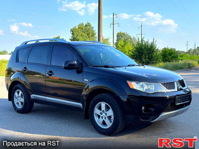 Чорний Міцубісі Аутлендер, об'ємом двигуна 2.4 л та пробігом 171 тис. км за 8999 $, фото 1 на Automoto.ua