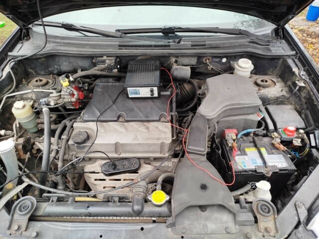 Черный Мицубиси Аутлендер, объемом двигателя 2.4 л и пробегом 149 тыс. км за 8800 $, фото 6 на Automoto.ua