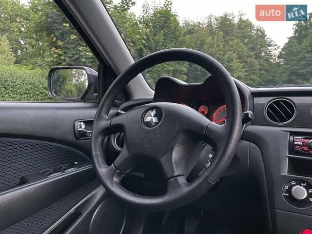 Чорний Міцубісі Аутлендер, об'ємом двигуна 2 л та пробігом 79 тис. км за 9500 $, фото 84 на Automoto.ua