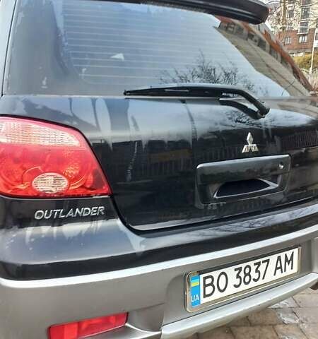 Черный Мицубиси Аутлендер, объемом двигателя 2 л и пробегом 73 тыс. км за 9500 $, фото 10 на Automoto.ua