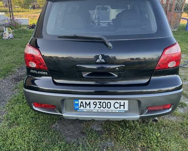 Чорний Міцубісі Аутлендер, об'ємом двигуна 2 л та пробігом 111 тис. км за 7500 $, фото 1 на Automoto.ua