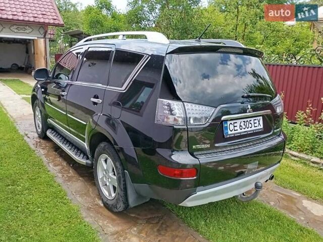 Черный Мицубиси Аутлендер, объемом двигателя 2.2 л и пробегом 279 тыс. км за 11000 $, фото 1 на Automoto.ua