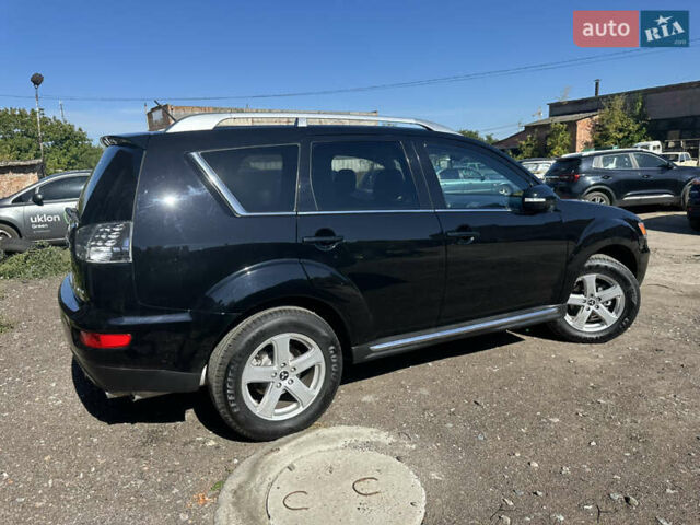 Черный Мицубиси Аутлендер, объемом двигателя 2 л и пробегом 240 тыс. км за 10999 $, фото 14 на Automoto.ua