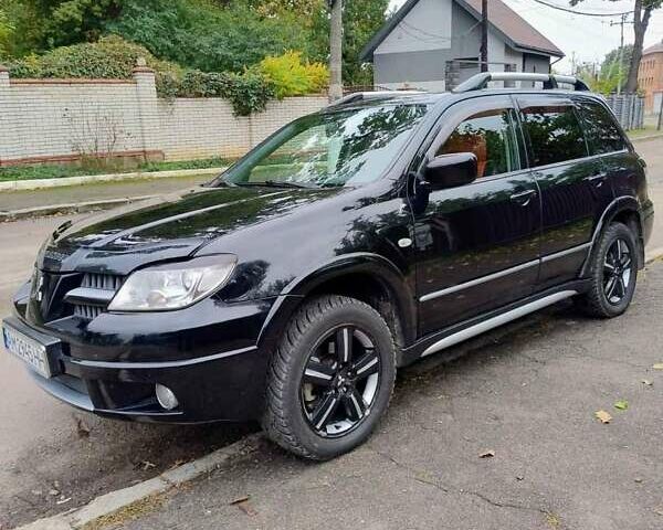 Черный Мицубиси Аутлендер, объемом двигателя 2 л и пробегом 223 тыс. км за 7200 $, фото 7 на Automoto.ua
