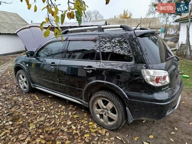 Чорний Міцубісі Аутлендер, об'ємом двигуна 2.38 л та пробігом 149 тис. км за 8800 $, фото 2 на Automoto.ua