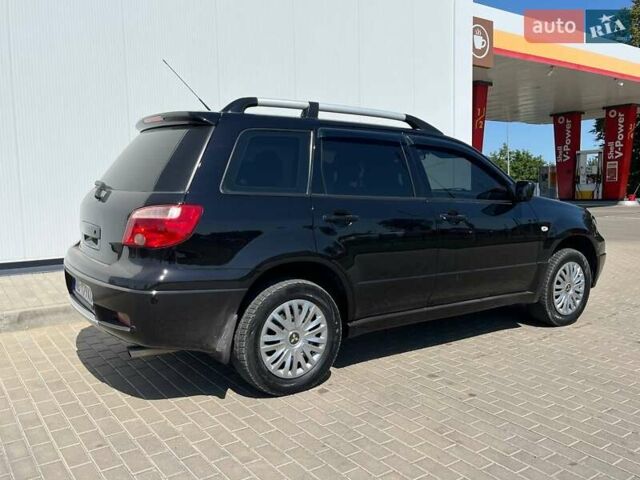 Черный Мицубиси Аутлендер, объемом двигателя 2 л и пробегом 236 тыс. км за 6699 $, фото 7 на Automoto.ua