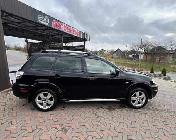 Черный Мицубиси Аутлендер, объемом двигателя 2.38 л и пробегом 220 тыс. км за 7500 $, фото 3 на Automoto.ua