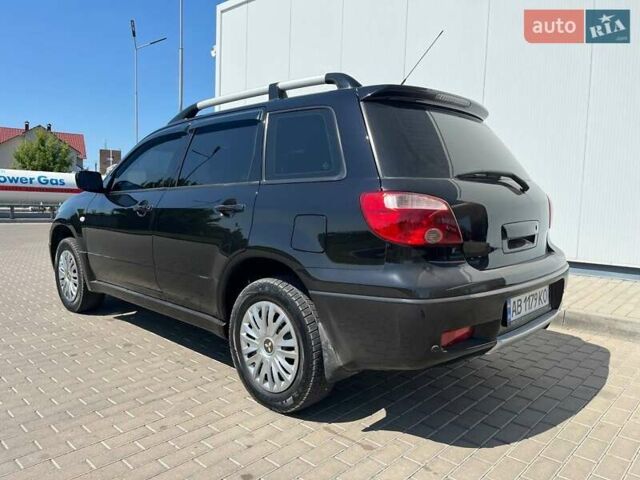 Черный Мицубиси Аутлендер, объемом двигателя 2 л и пробегом 236 тыс. км за 6699 $, фото 2 на Automoto.ua