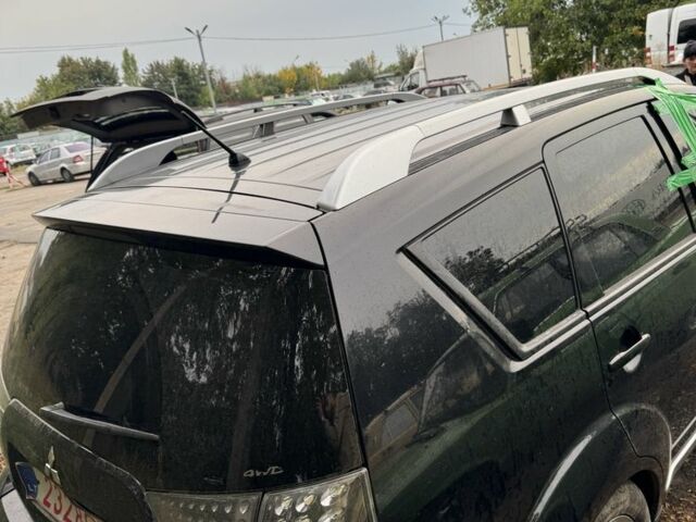 Черный Мицубиси Аутлендер, объемом двигателя 2.4 л и пробегом 246 тыс. км за 2600 $, фото 1 на Automoto.ua