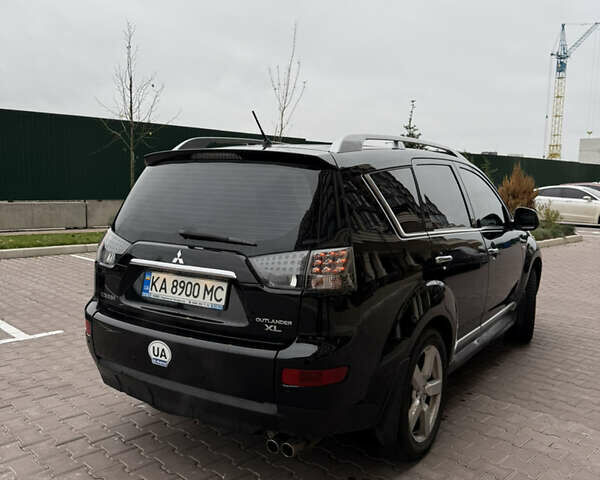 Черный Мицубиси Аутлендер, объемом двигателя 3 л и пробегом 260 тыс. км за 9500 $, фото 3 на Automoto.ua
