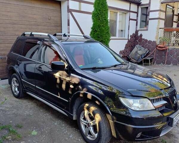 Черный Мицубиси Аутлендер, объемом двигателя 2 л и пробегом 223 тыс. км за 7200 $, фото 3 на Automoto.ua
