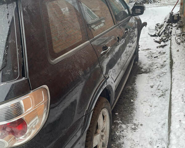 Черный Мицубиси Аутлендер, объемом двигателя 2 л и пробегом 109 тыс. км за 1550 $, фото 3 на Automoto.ua