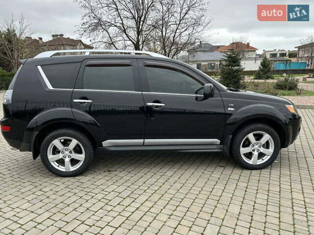 Черный Мицубиси Аутлендер, объемом двигателя 3 л и пробегом 77 тыс. км за 11800 $, фото 1 на Automoto.ua