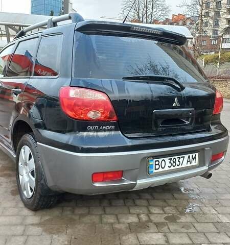 Черный Мицубиси Аутлендер, объемом двигателя 2 л и пробегом 73 тыс. км за 9500 $, фото 7 на Automoto.ua