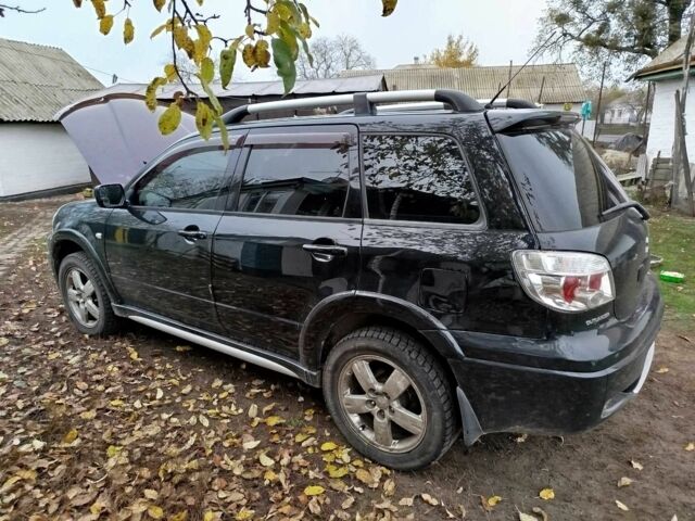Черный Мицубиси Аутлендер, объемом двигателя 2.4 л и пробегом 149 тыс. км за 8800 $, фото 2 на Automoto.ua