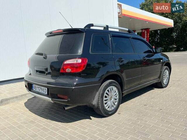 Черный Мицубиси Аутлендер, объемом двигателя 2 л и пробегом 236 тыс. км за 6699 $, фото 6 на Automoto.ua