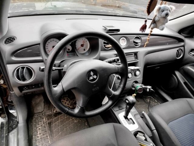 Черный Мицубиси Аутлендер, объемом двигателя 2.4 л и пробегом 149 тыс. км за 8800 $, фото 8 на Automoto.ua