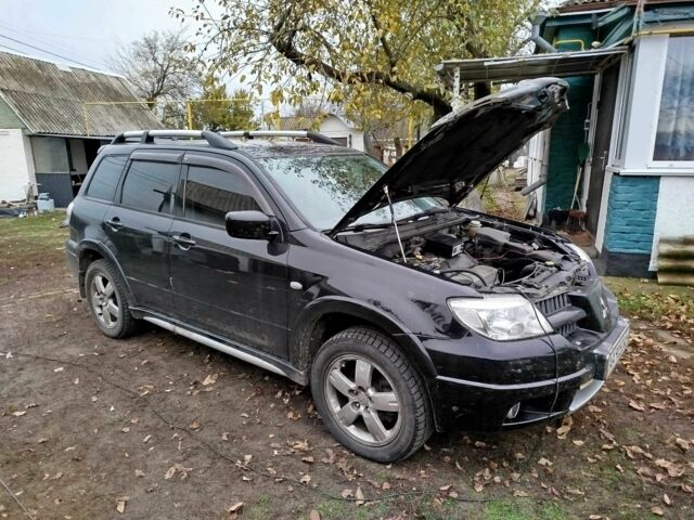 Черный Мицубиси Аутлендер, объемом двигателя 2.4 л и пробегом 149 тыс. км за 8800 $, фото 5 на Automoto.ua